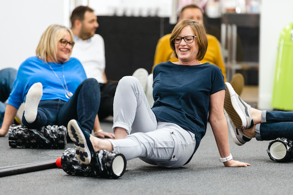 woman using a massage roller