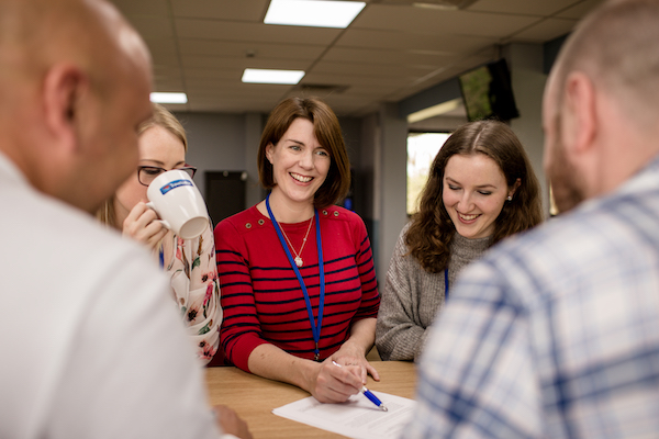 employees around a contract